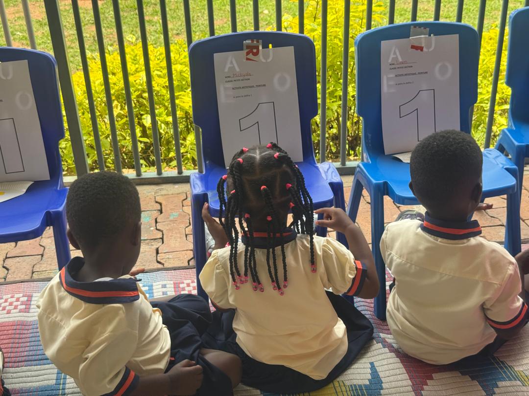Young learners using classroom technology.